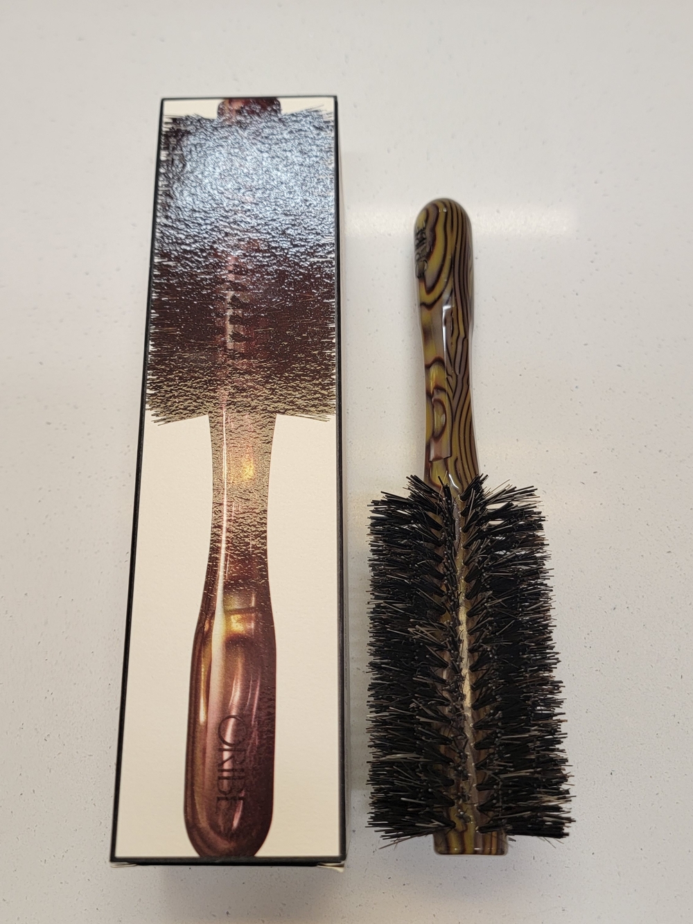 Oribe Round Styling Brush in Brown and Black